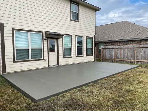 Concrete patio on backyard of house